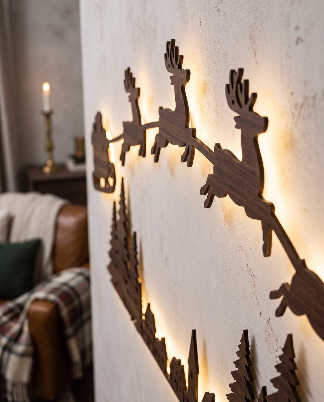 Close-up of the edge of The Night Before reindeer silhouette panels, wood-grain finish, with the LED halo glowing on the wall behind
